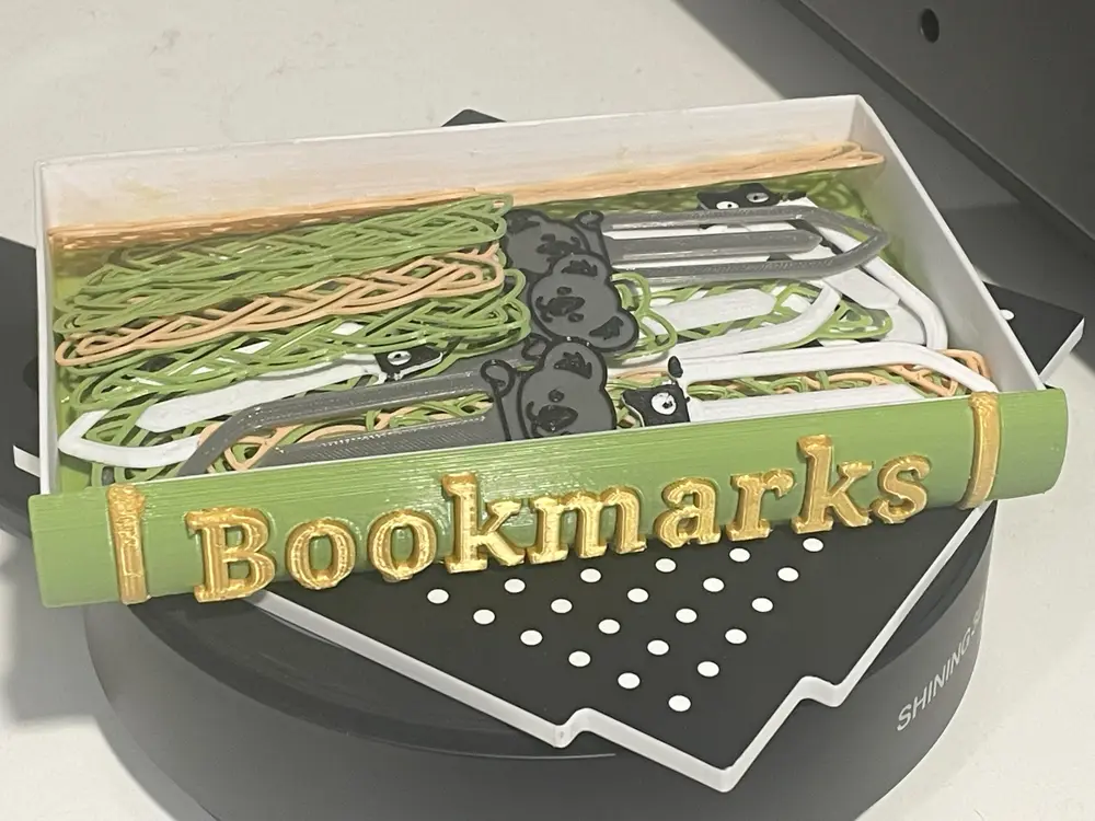 Book shaped book mark box.