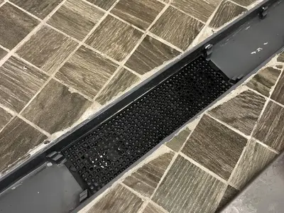 Shower drain grate