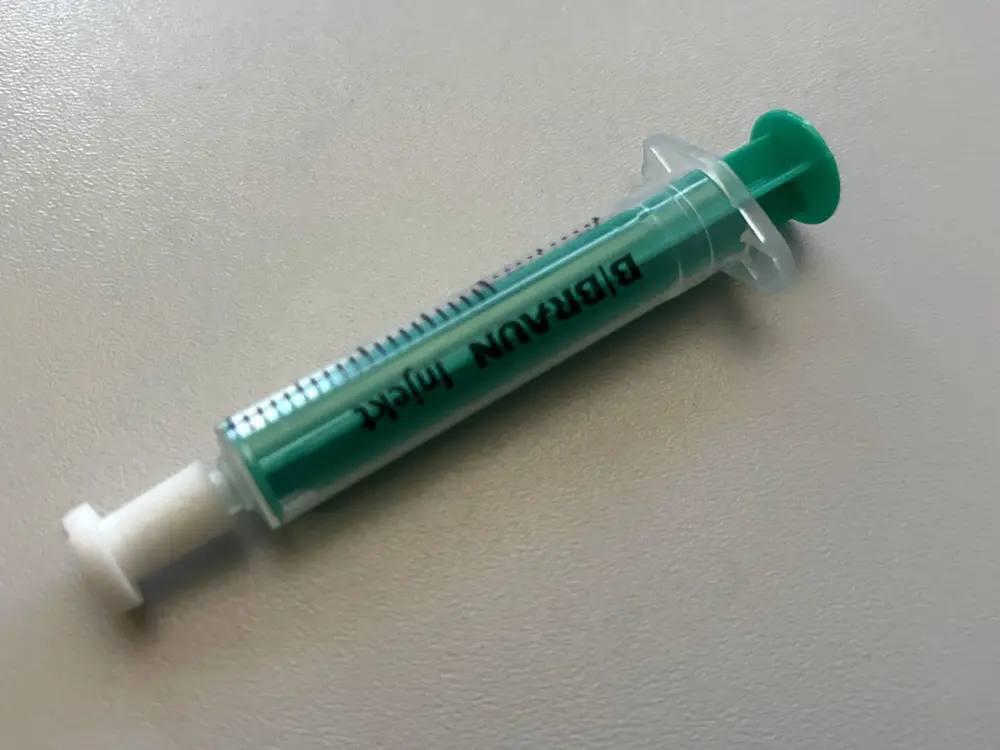 Cap for a syringe