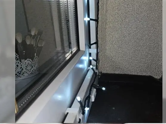 Hook for holding Christmas lights in the window