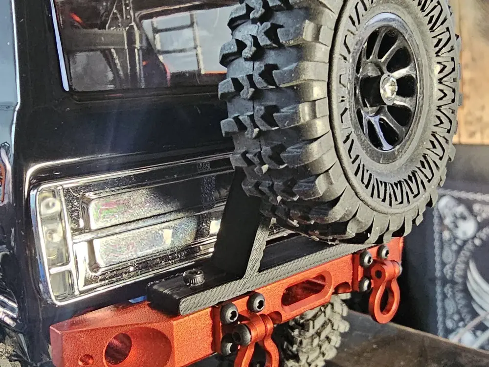 Rear bumper spare tire mount