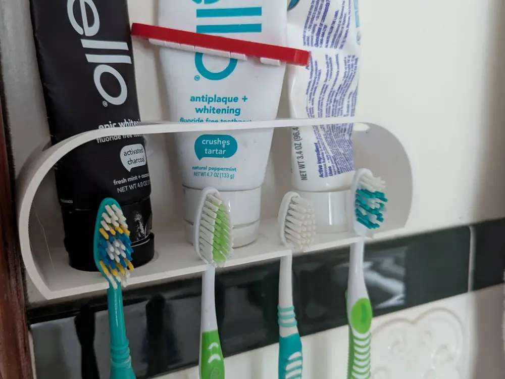 Toothpaste and brush holder