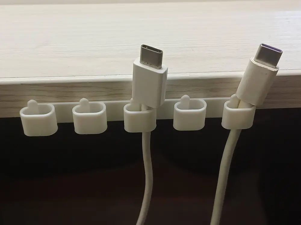 Desk cable organizer with bottom mount.