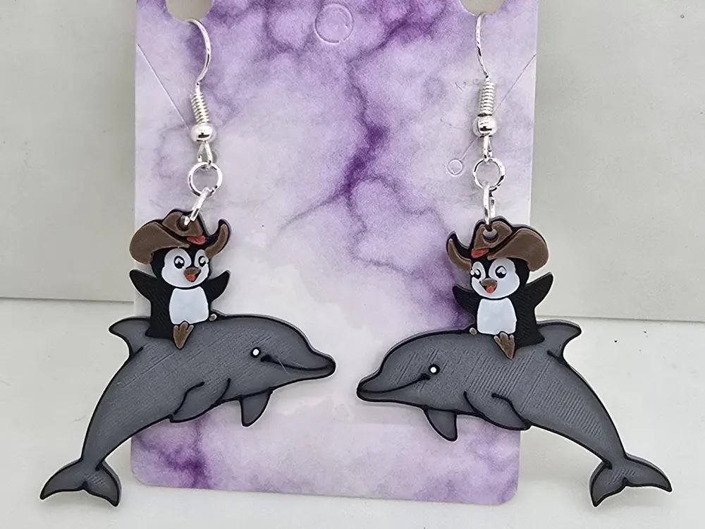 Penguin riding a dolphin Earrings