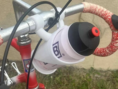 bottle holder for bicycle handlebars