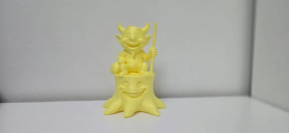 Cheerful Devil on a Tree Stump Figurine