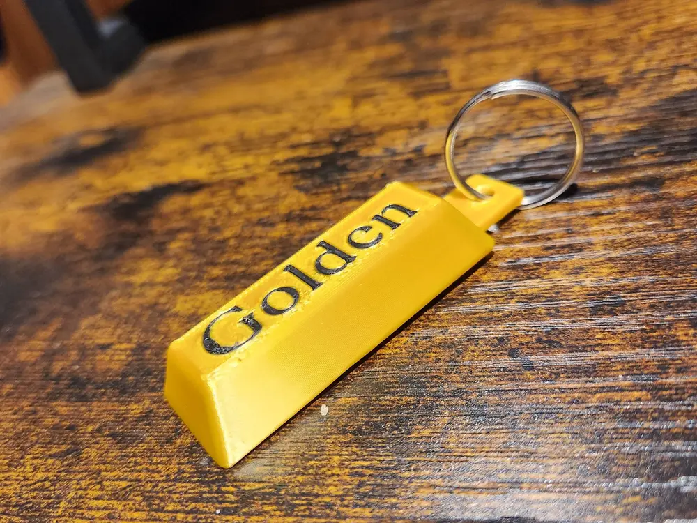 Golden Huntr/x keychain