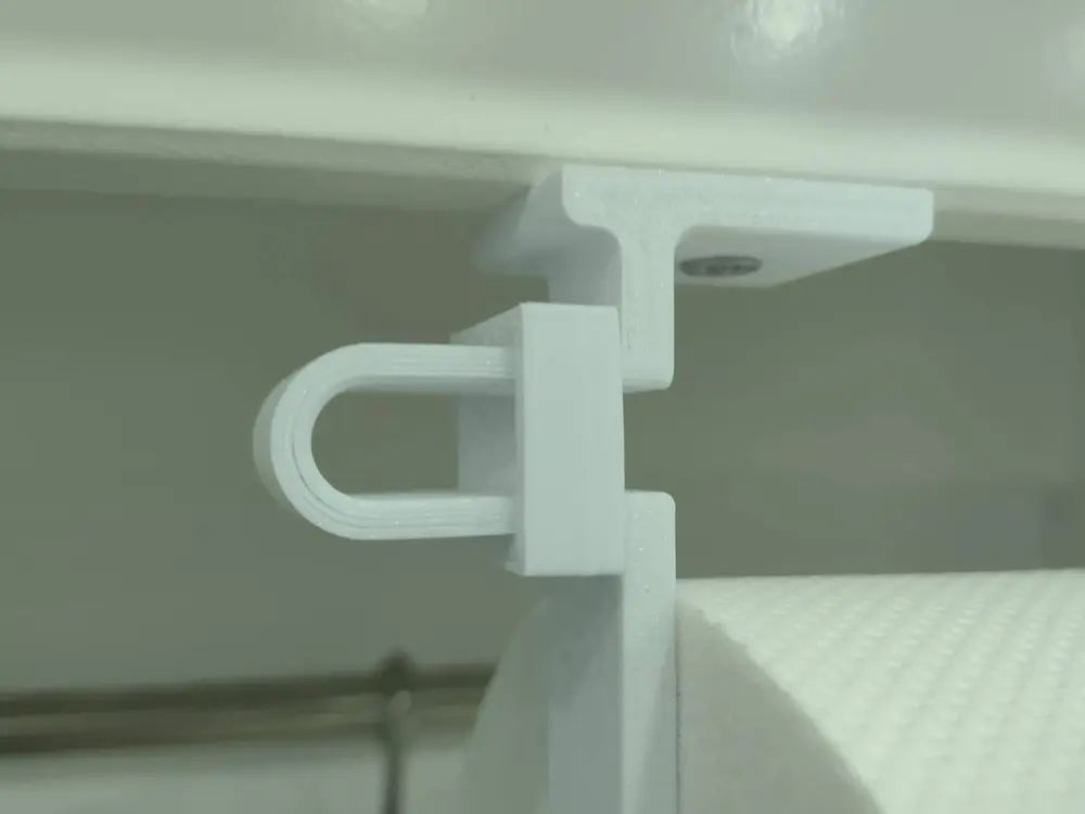 Clip for paper towel holders