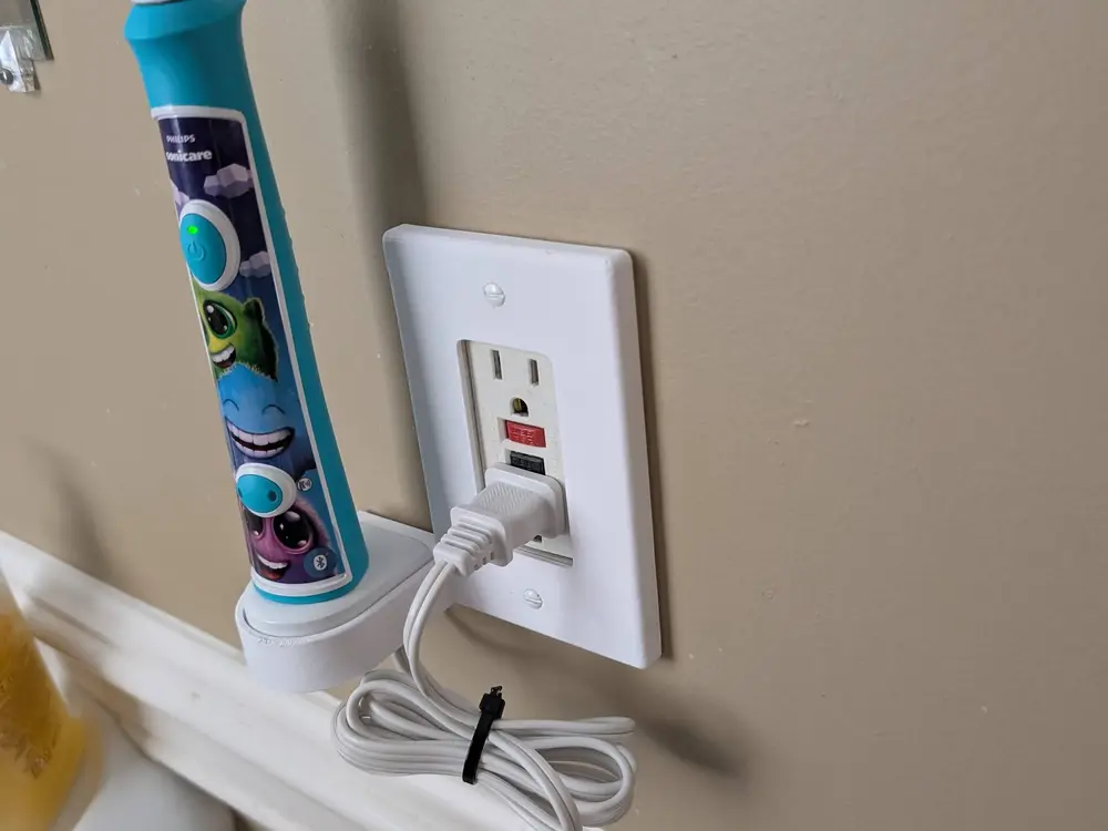 Outlet Cover With Philips Toothbrush Holder