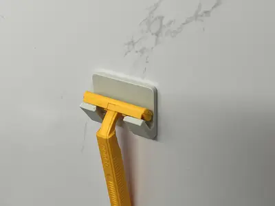 wall-mounted razor holder