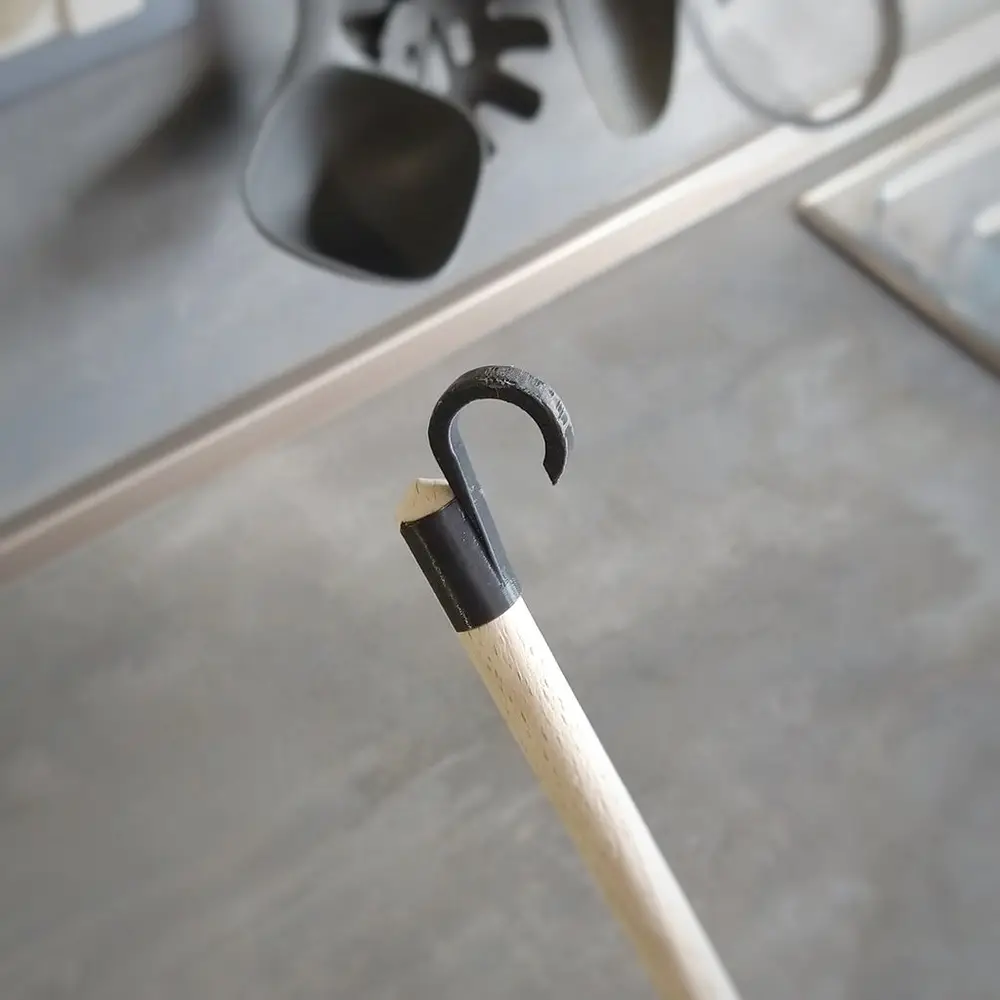 Spoon hook for kitchen rail