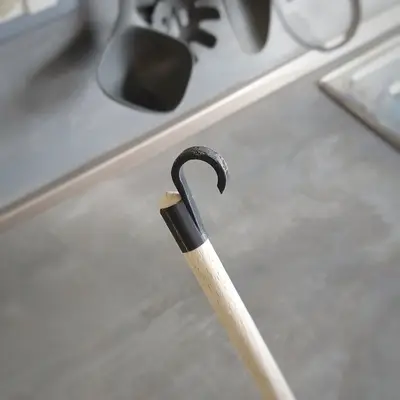 Spoon hook for kitchen rail