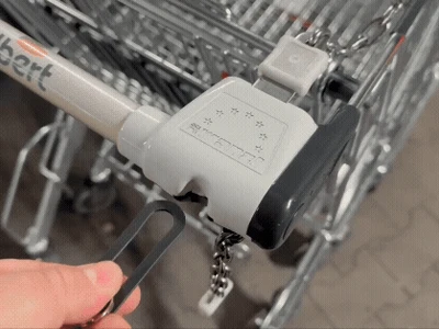 Removable shopping cart coin with seat belt plug