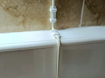Self-adhesive cable clip
