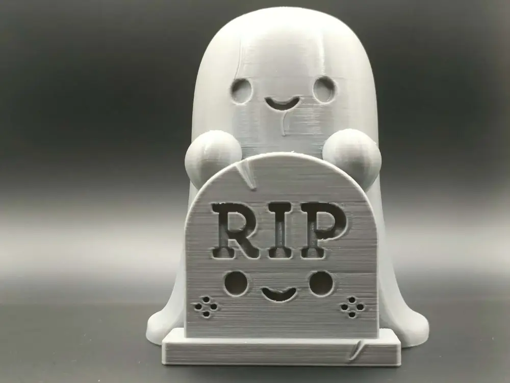 Cute Ghost Behind a RIP Tombstone