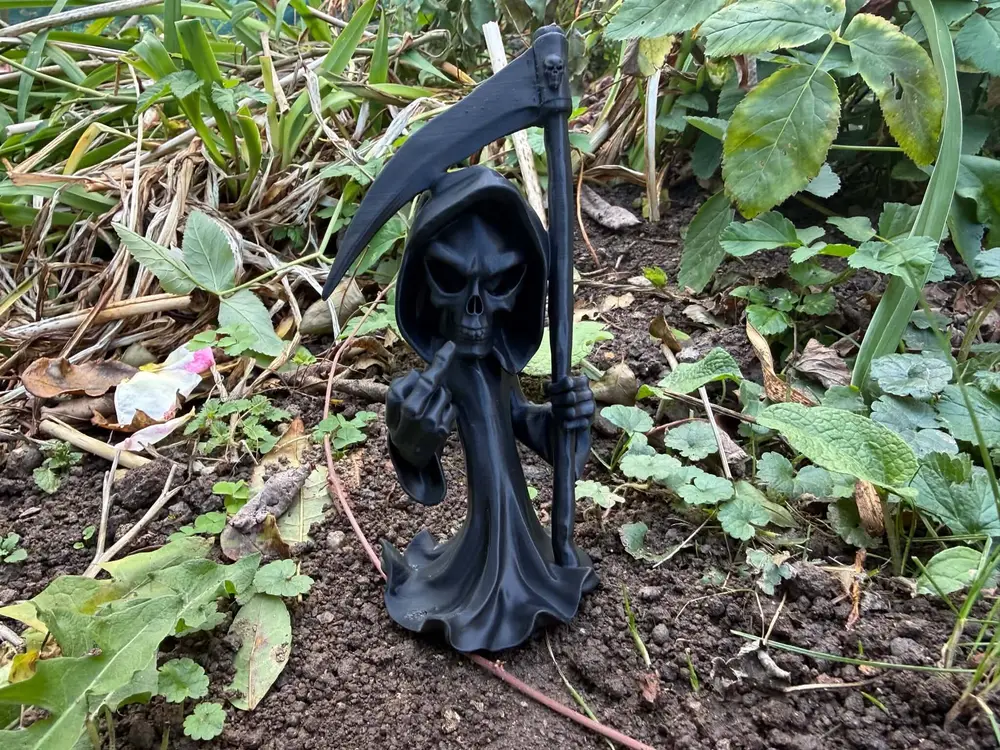 Halloween Grim Reaper showing middle finger