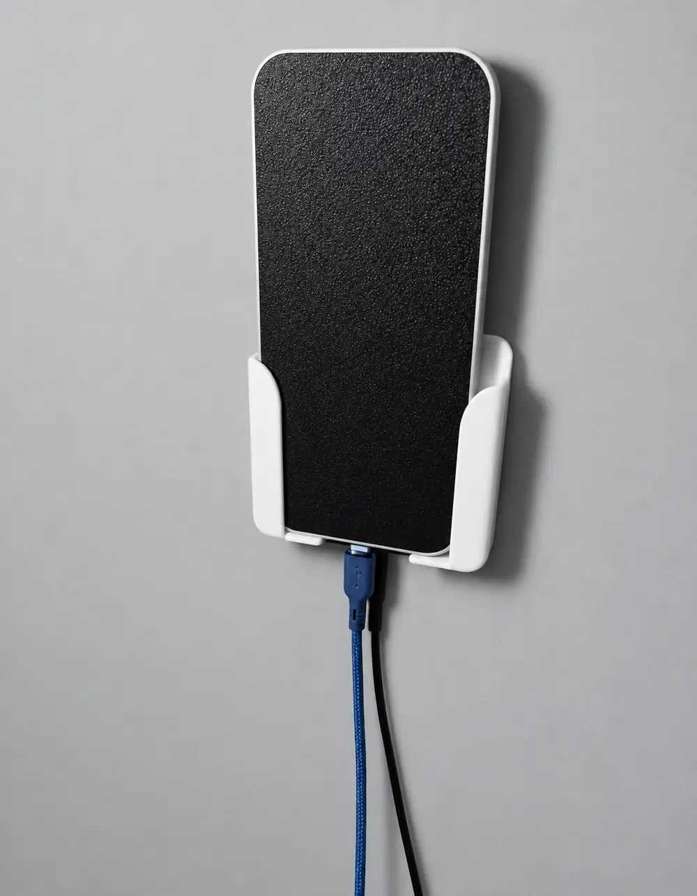Wall mounted phone holder