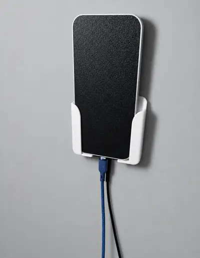 Wall mounted phone holder